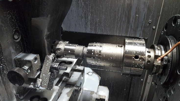 CNC machine performing precision machining on a Cannulated Headed Reamer to ensure high accuracy.